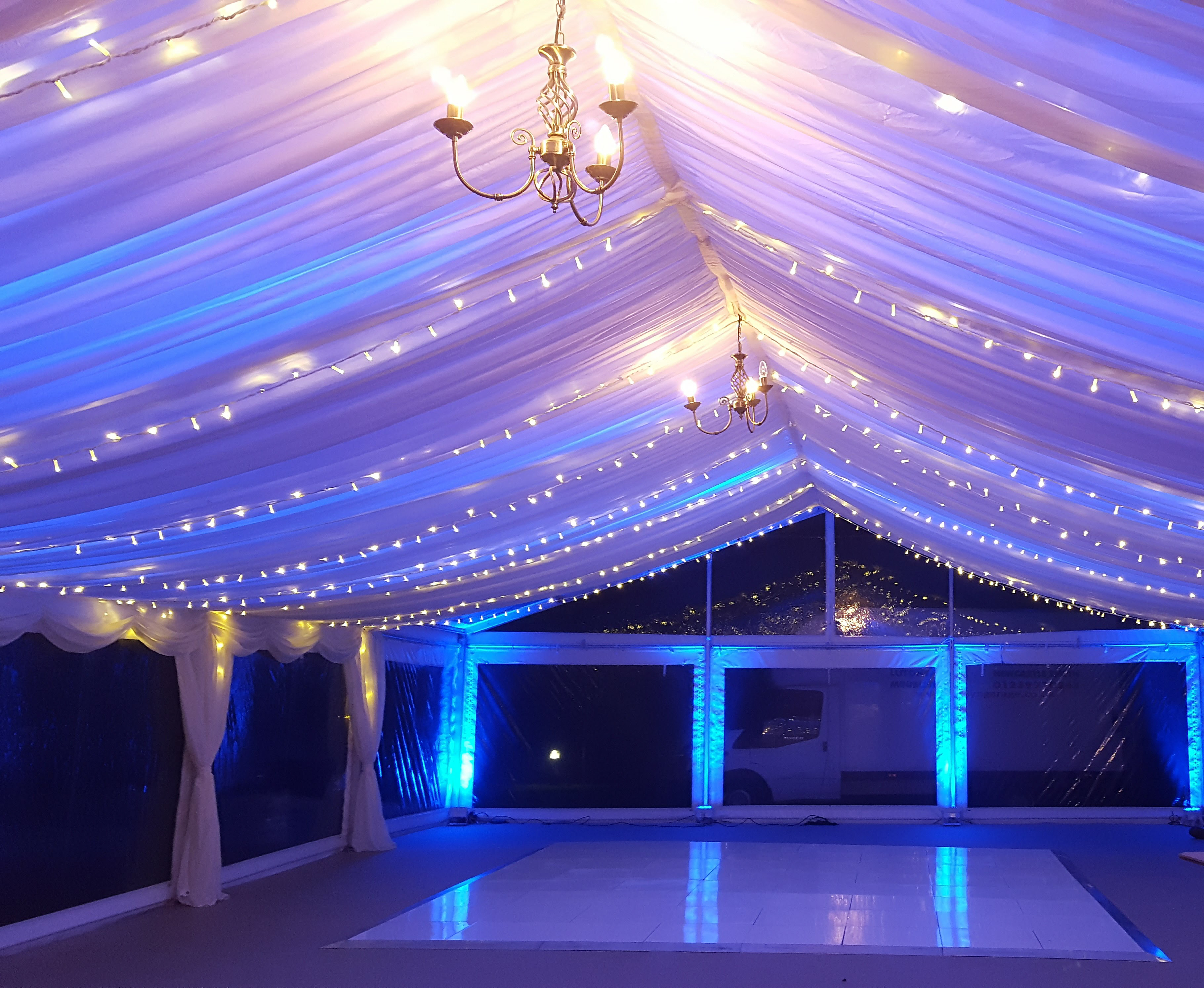fairy lighting and colour wash in wedding marquee